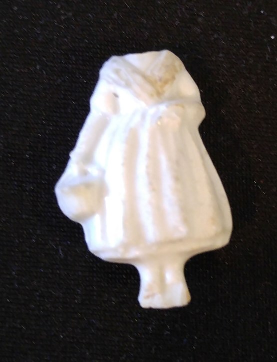 ceramic figure with no head, holding a basket