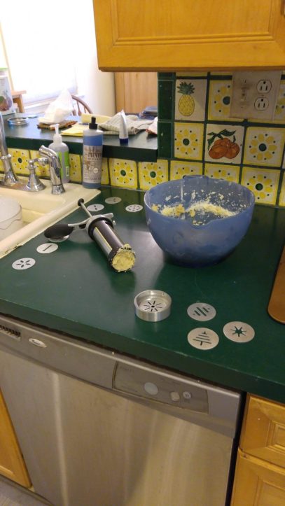 Cookie press loaded to make star shaped cookies