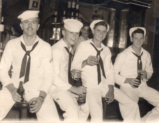 Four sailors and a bartender
