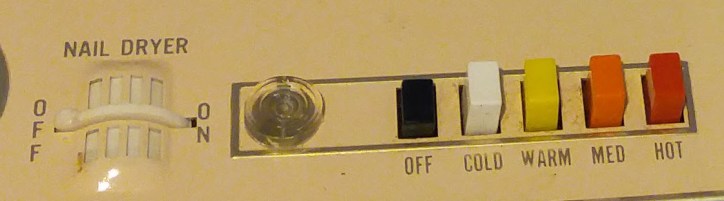 Built-in nail dryer with buttons and on-off light.