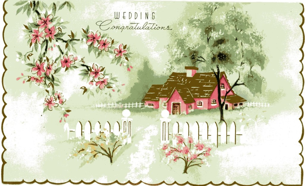 Cottage behind a white picket fence surrounded by a tree, two bushes and a flowering vine.